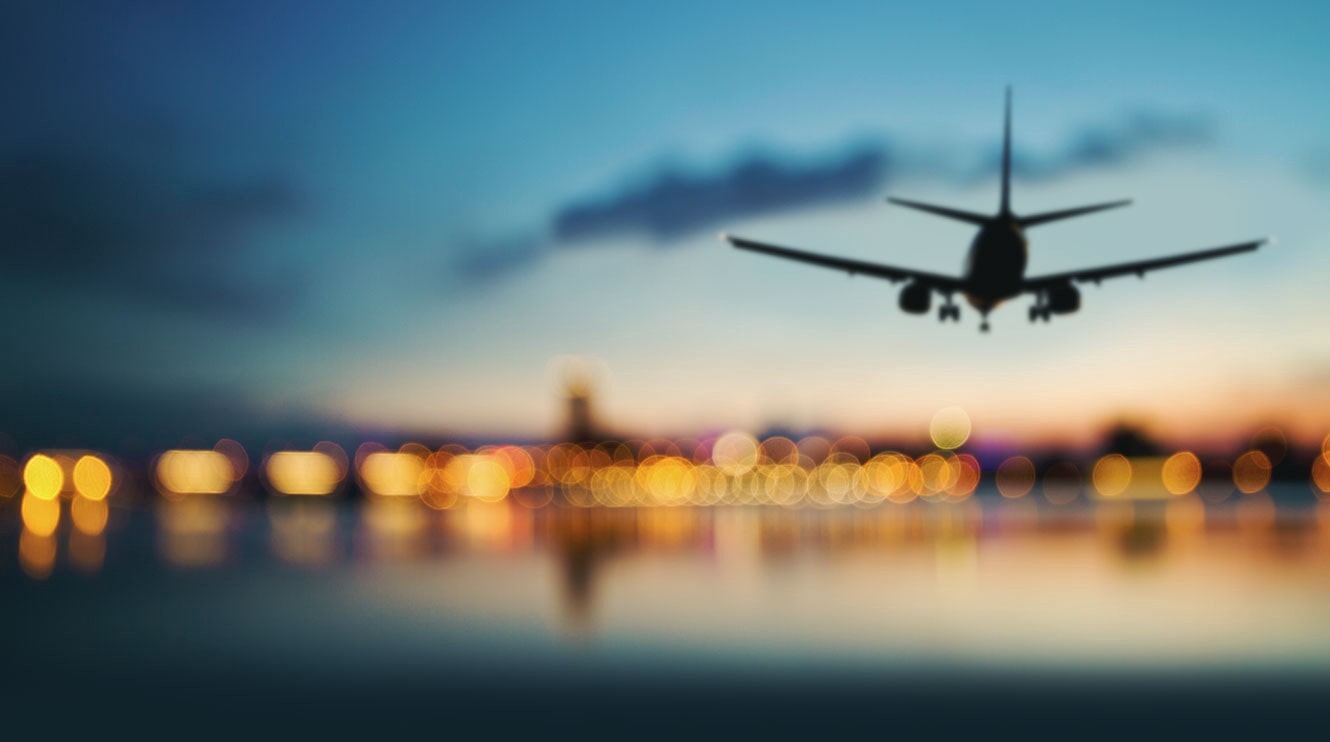 Aircraft landing over airport lights